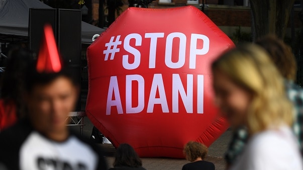 People attend an anti-Adani rally in Brisbane.