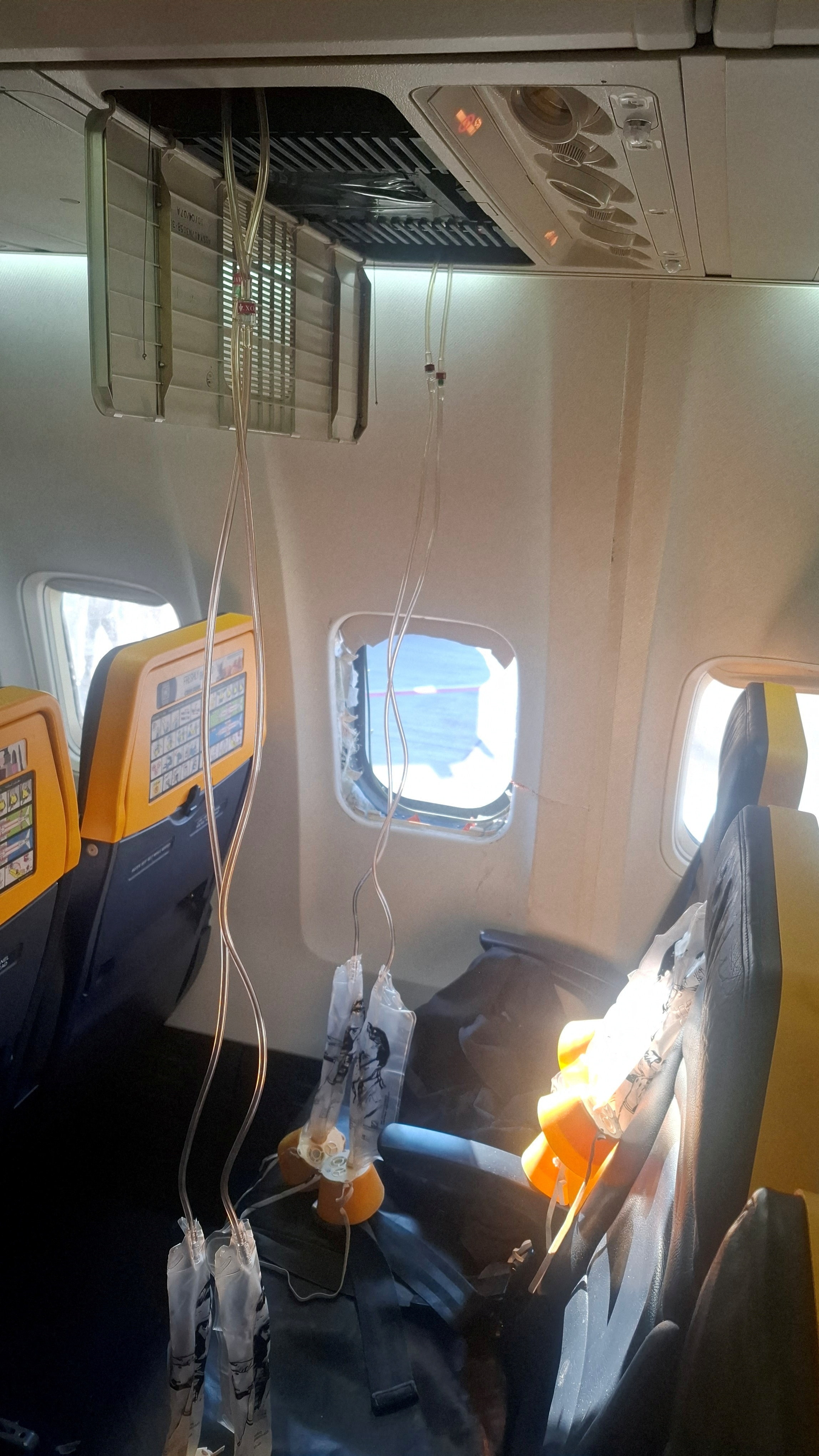 Wife recounts horror as husband sucked out of Ryanair plane window