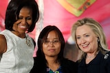 Zin Mar Aung standing between Michelle Obama and Hillary Clinton