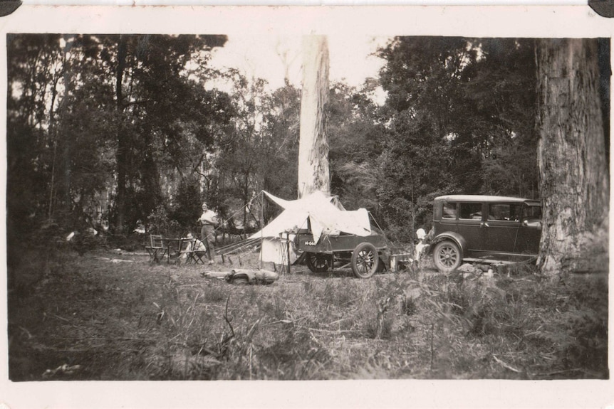 A black and white photo of two women camping in the early 1900s.