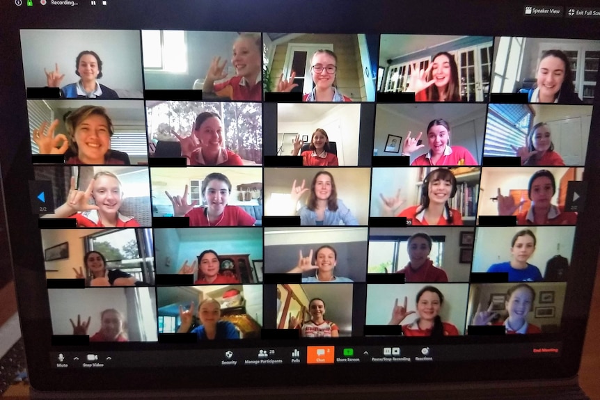 An image of a zoom call with students faces learning AUSLAN