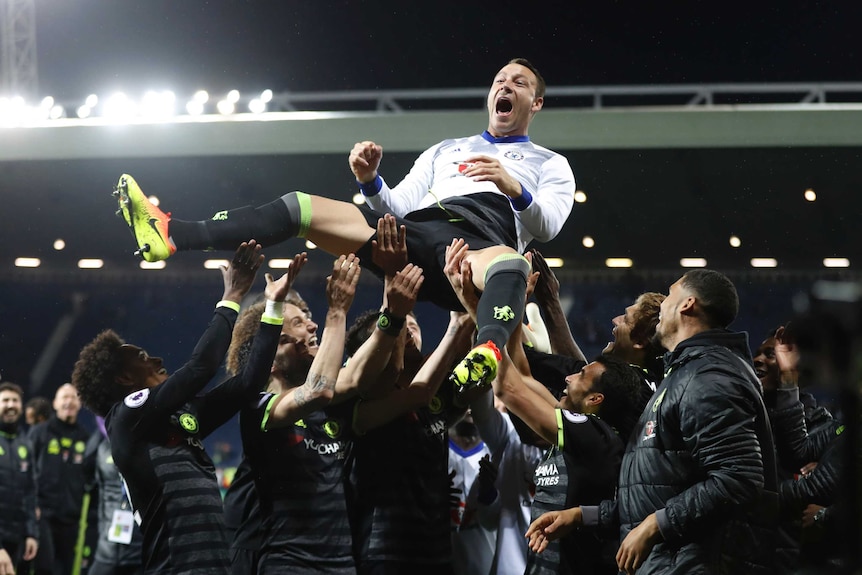 Chelsea veteran John Terry is thrown in the air by his team-mates after beating West Brom.
