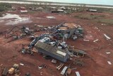 Aerial view of destruction, sheds smashed, donger on its side, after tropical cyclone Ilsa.