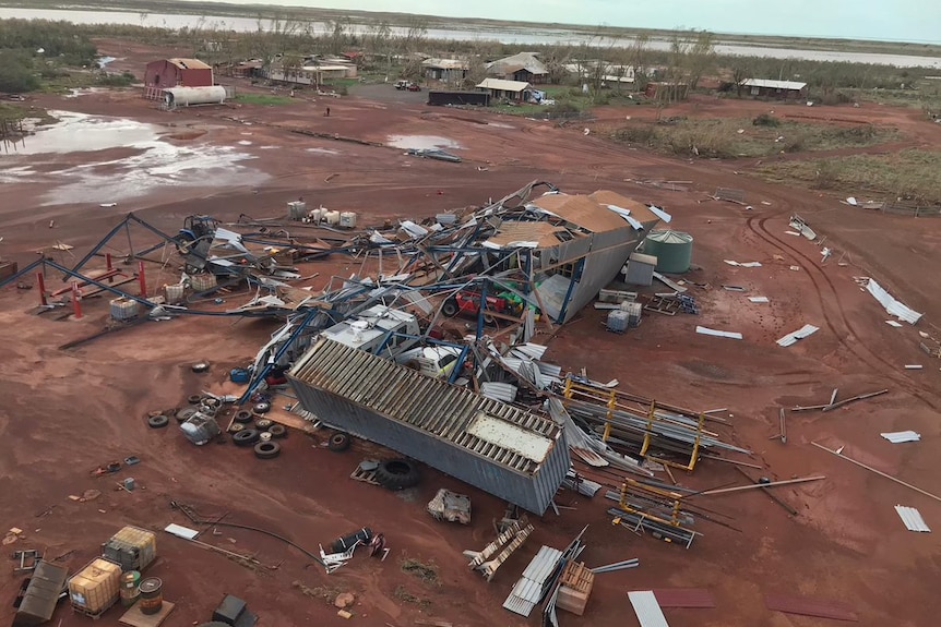Aerial view of destruction, sheds smashed, donger on its side, after tropical cyclone Ilsa.