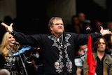 AFL CEO Andrew Demetriou has defended Meat Loaf's pre-game performance before the grand final at the MCG.