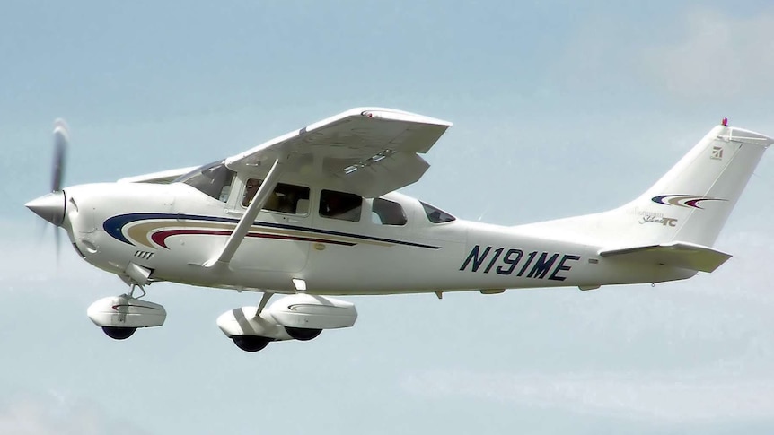 A Cessna 206 light plane mid flight.