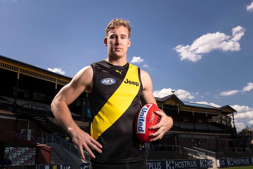 Tom Lynch wears a Richmond jersey at a media opportunity in Melbourne.