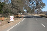 40km speed limit signs at road works near Wamboin in southern NSW. Generic rural road works. July 2012.