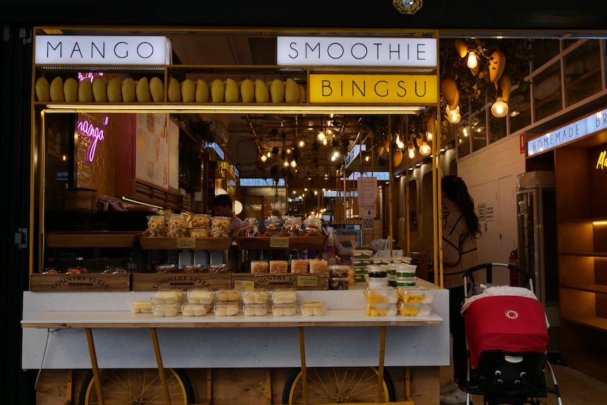 A store front with packaged desserts on display