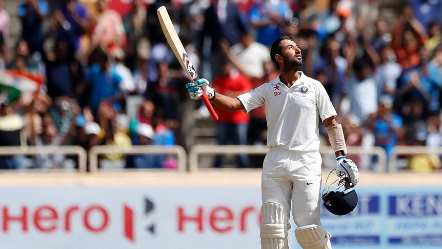 Cheteshwar Pujara looks to the skies after a century in Ranchi