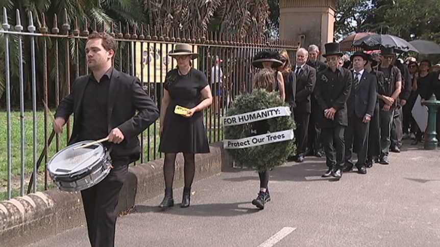 A procession of mourners at Centennial Park.