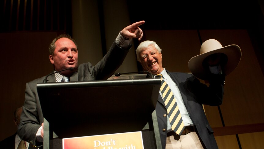 Senator Barnaby Joyce and Bob Katter auction Katter's hat at a rally in Canberra.