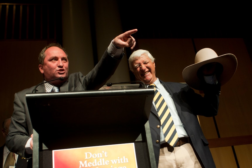 Senator Barnaby Joyce and Bob Katter auction Katter's hat at a rally in Canberra.