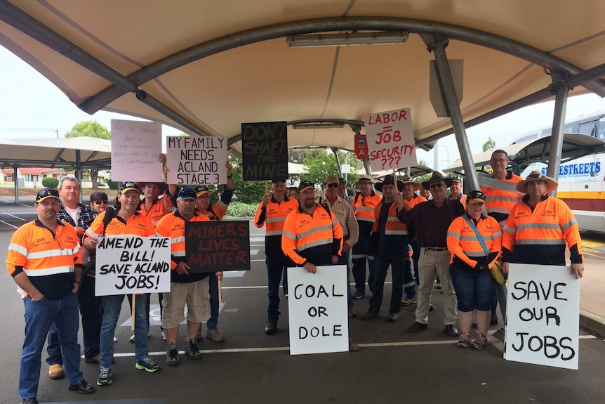 Mine workers holding placards