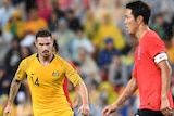 Jamie Maclaren looks to close the ball down against South Korea