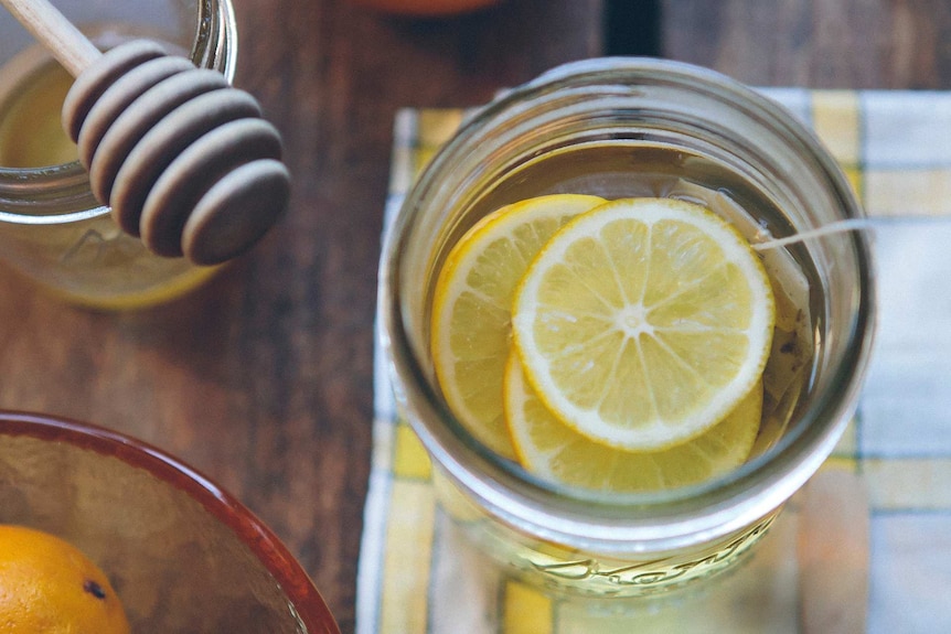 Hot honey and lemon drink in a jar