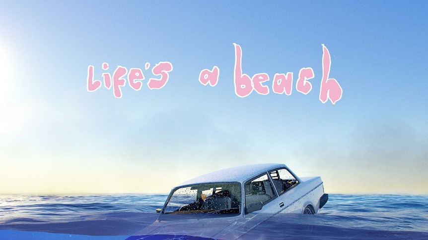 Photograph of a car in the ocean with album title above.