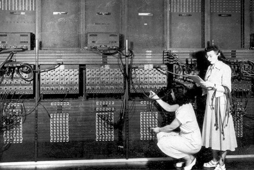 Two women working with the giant Electronic Numerical Integrator And Computer in 1946