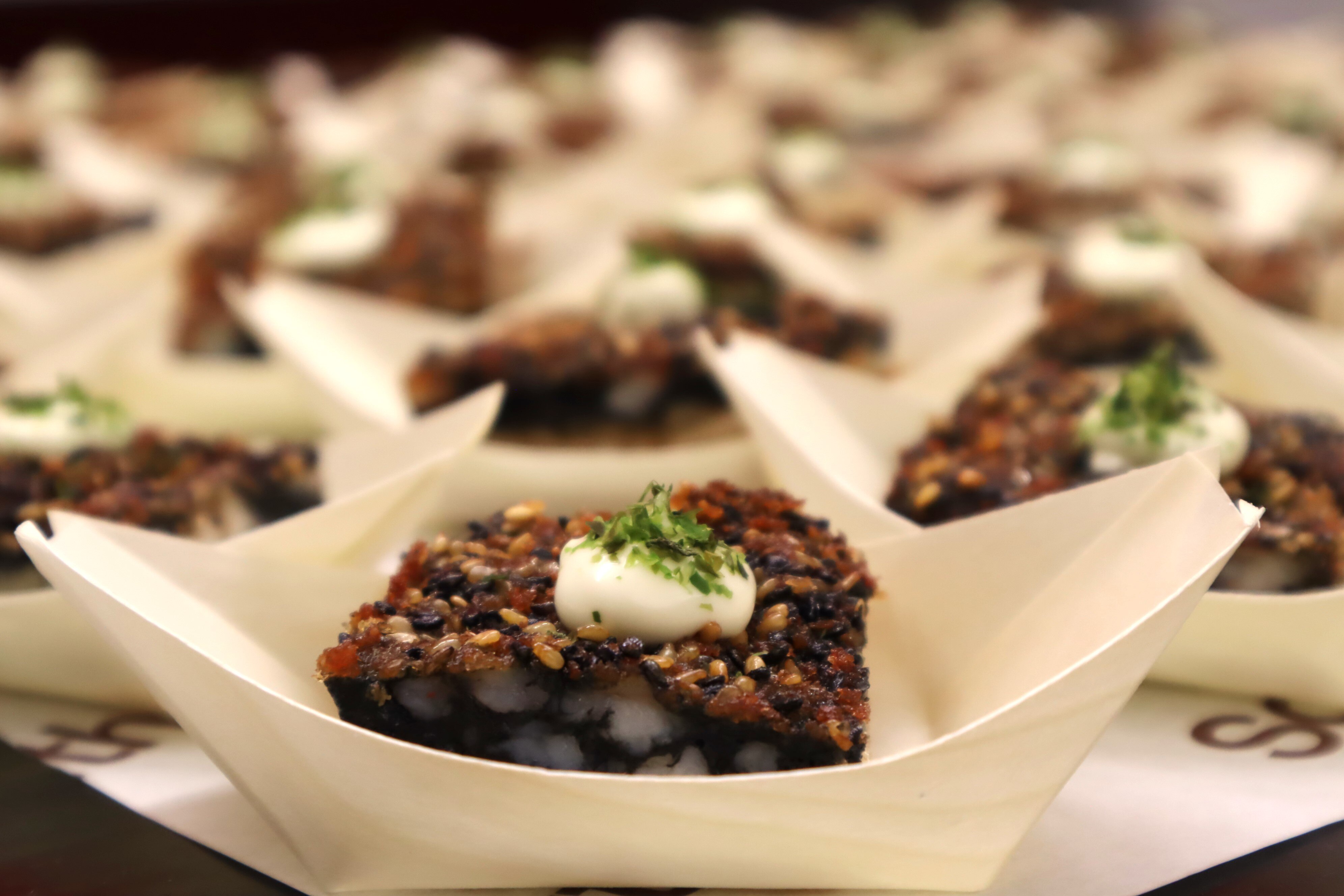 Close up on a truffle prawn toast tasting sample.