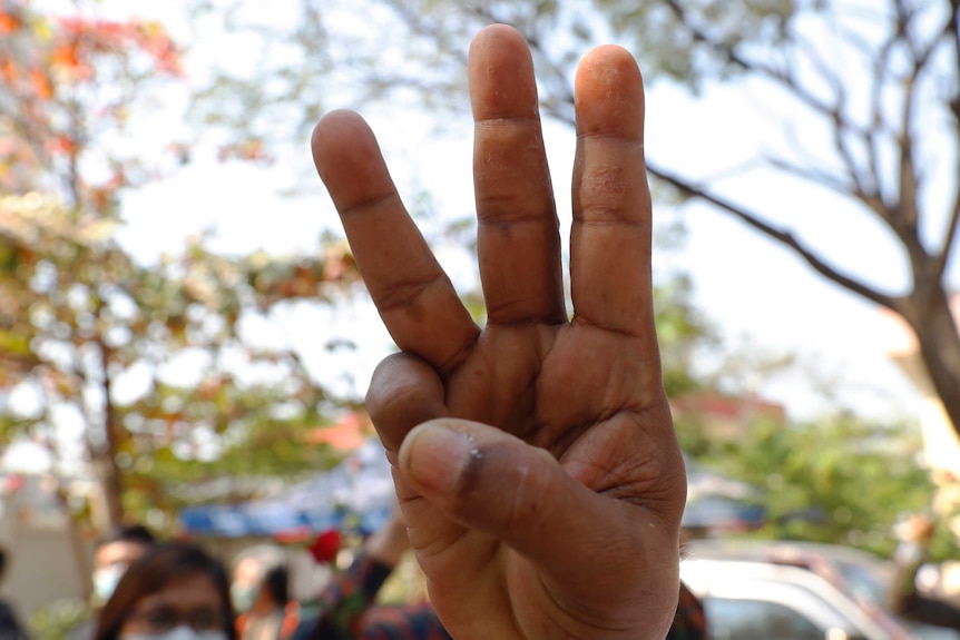 A supporter shows a three-finger salute of protest in Myanmar