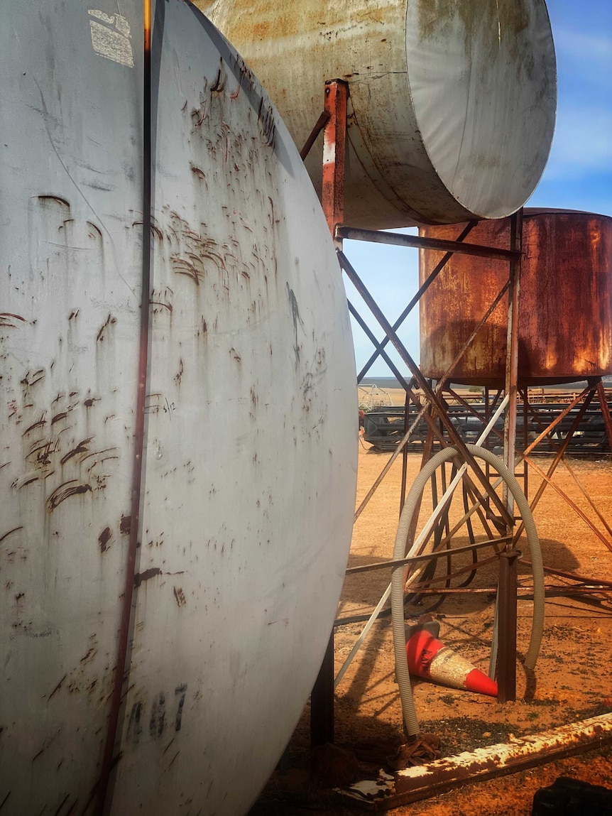 Three fuel tanks on a farm.