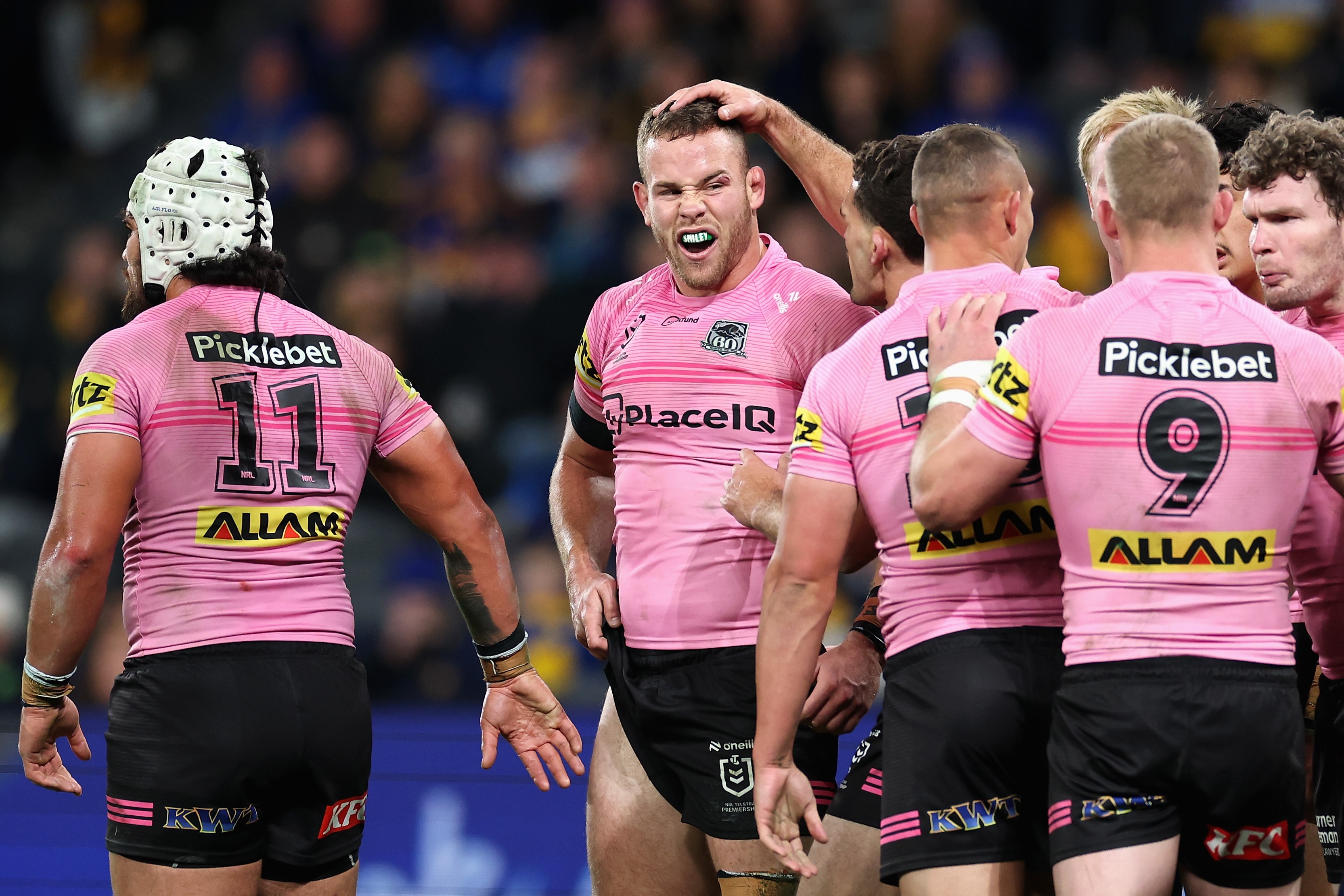 A rugby league player celebrates an NRL try 