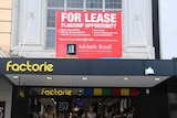 For Lease sign on a building awning.