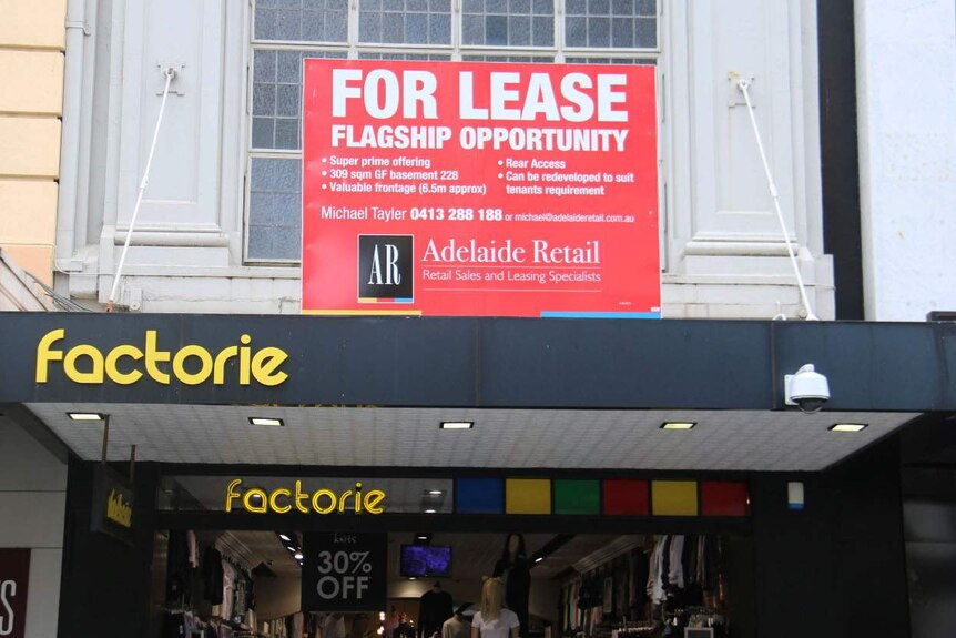 For Lease sign on a building awning.