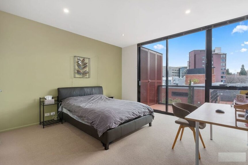 A second-storey bedroom gives a view of Hobart's CBD.