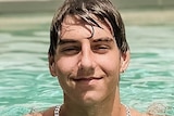A young man in a swimming pool.