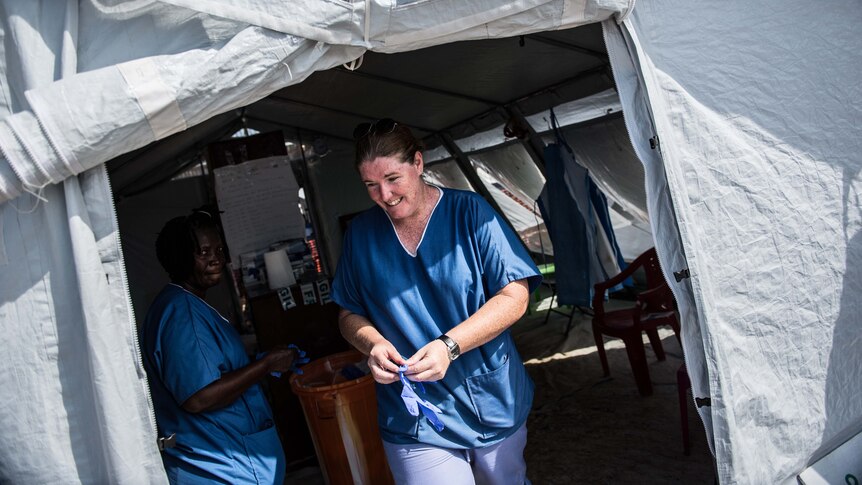 Amanda McClelland walks of a medical tent
