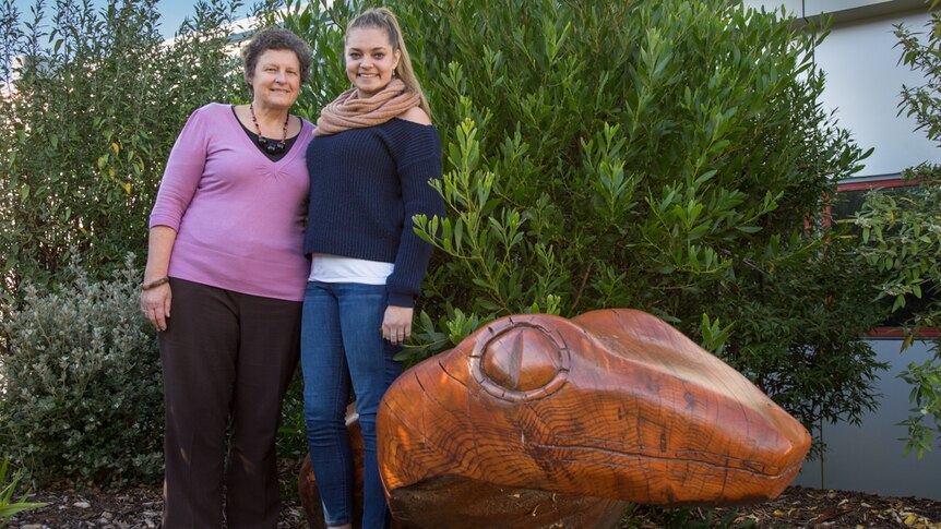 Teacher, Susan Hawkins with student, Naarah Barnes in the Aboriginal garden at Claremont College.