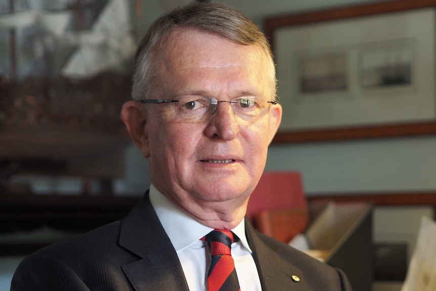 A man wearing a suit and tie