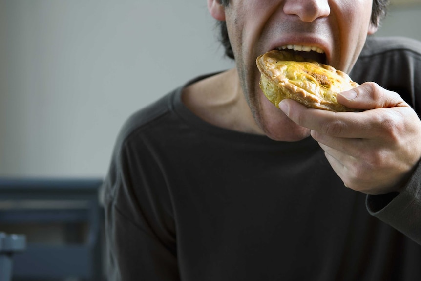 Man eating pie