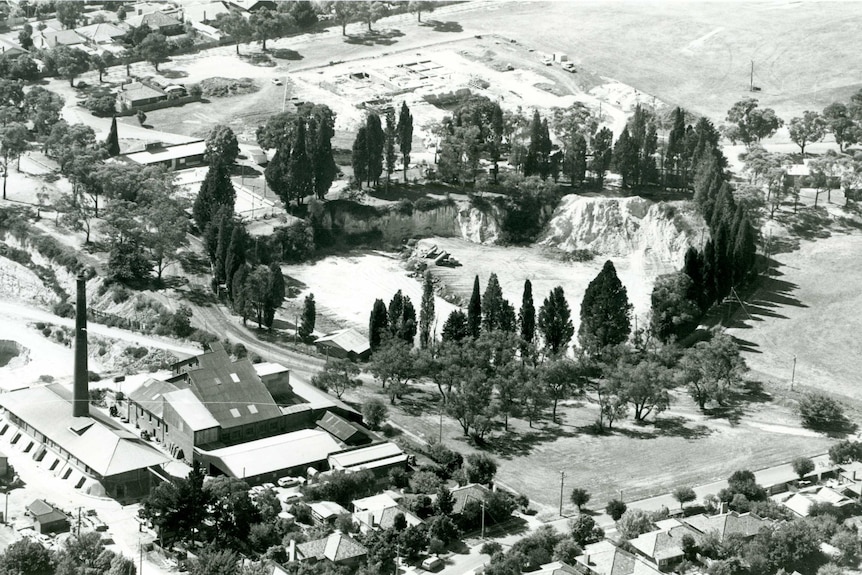 A black and white photo of Surrey Dive in Box hill without any water in it.