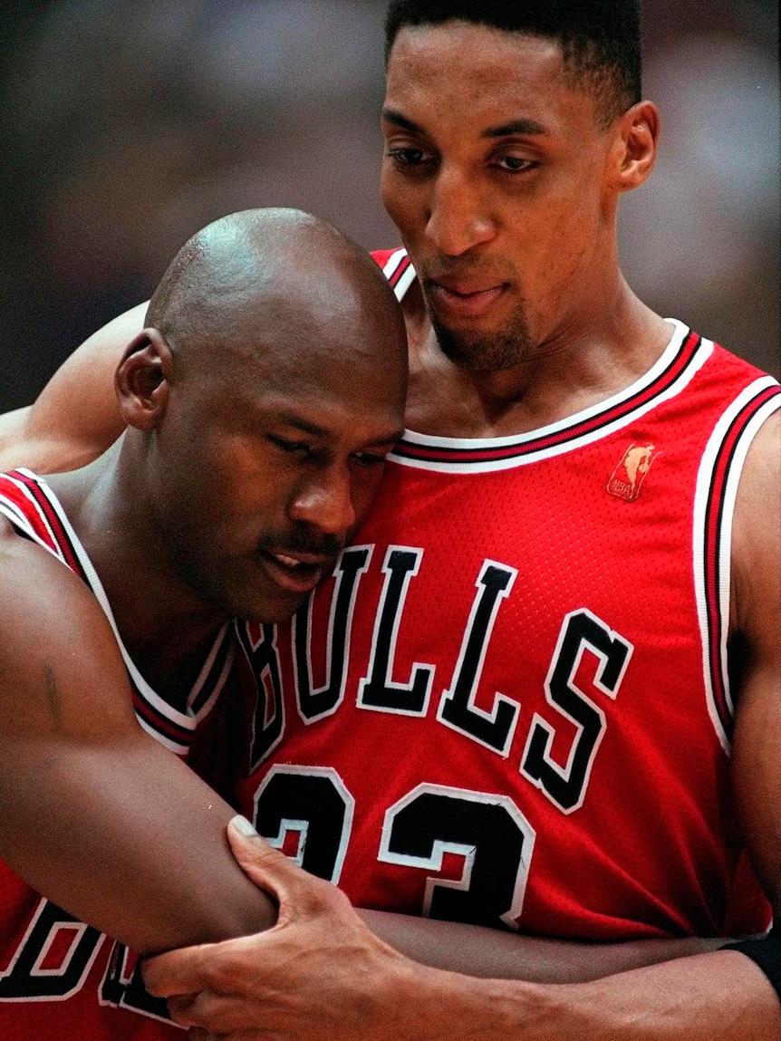Scottie Pippen holds up Michael Jordan during game five of the 1997 NBA Finals between the Chicago Bulls and Utah Jazz.