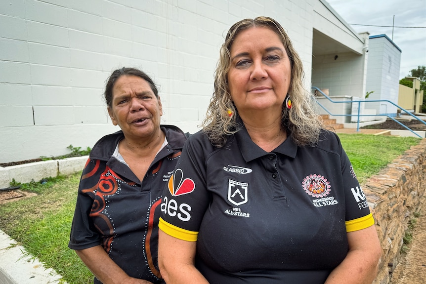 two indigenous women look at camera