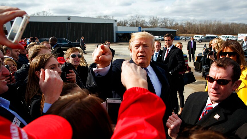 Donald Trump greets supporters