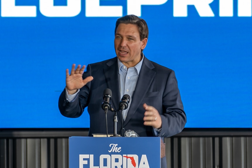 A man at the rostrum.