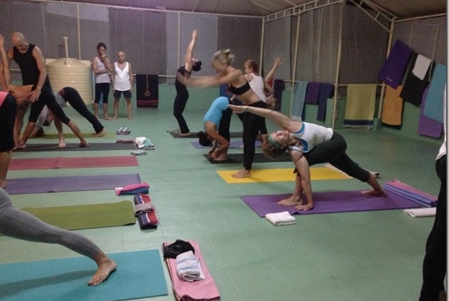 Heather Eldridge practicing yoga at a Lino Miele workshop at Kovolam, India.
