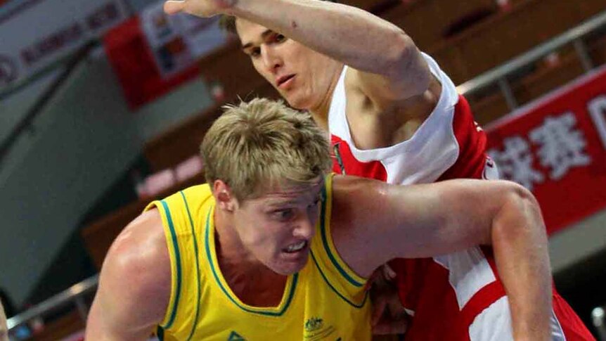Pipped at the death ... Australia's Alexey Kurtsevich dribbles past Ivan Nelyubov.