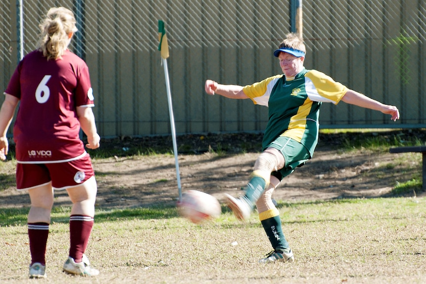 Carol Askew kicks a soccer ball with her right foot for Sylvania Heights FC.