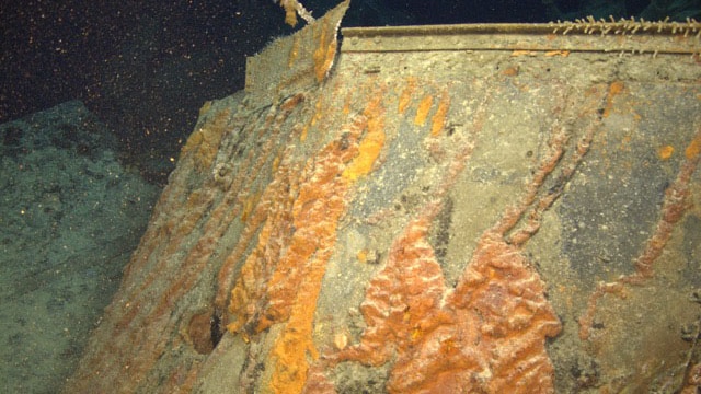 Close-up of previously unseen 15cm shell hole through bridge of HMAS Sydney