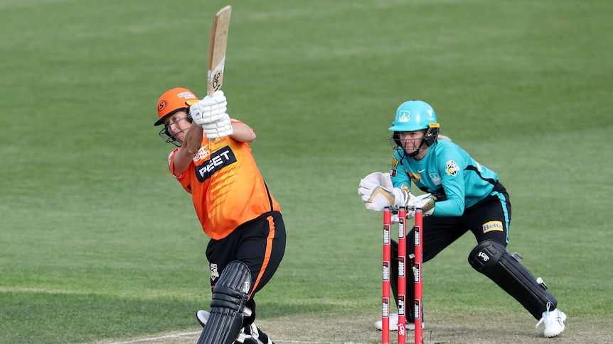 Perth Scorchers batter Sophie Devine completes her swing during the WBBL game against the Brisbane Heat.