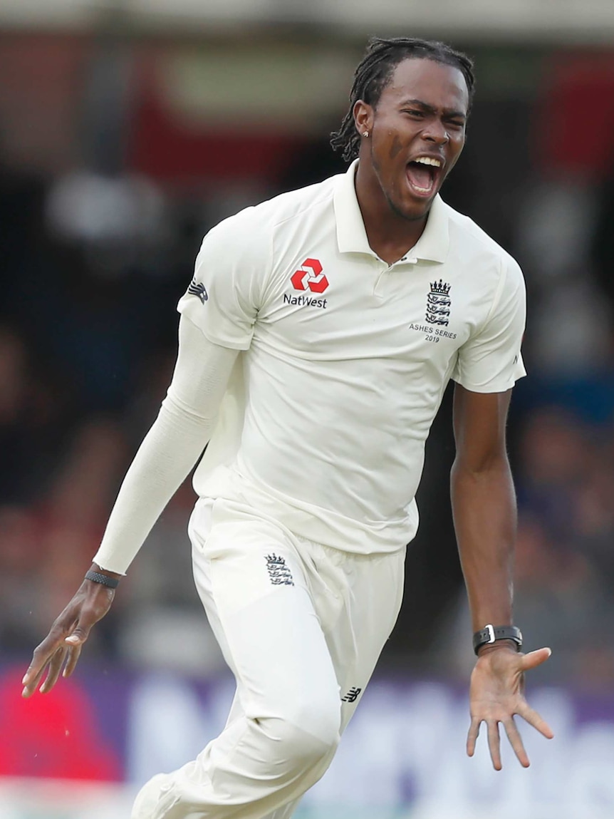 Jofra Archer spreads his arms and roars as he celebrates the wicket of David Warner