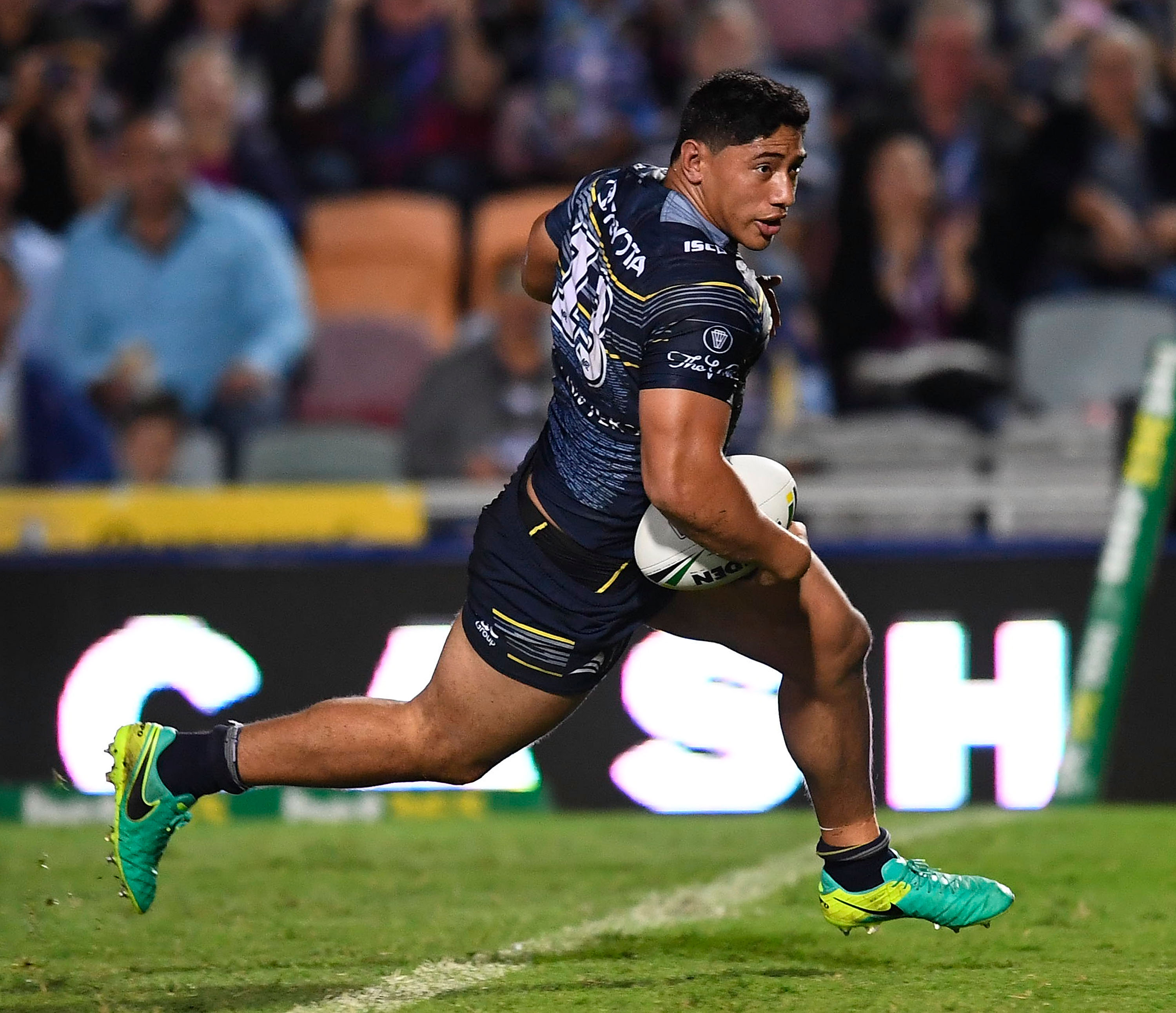 Jason Taumalolo runs the ball during a rugby league match.