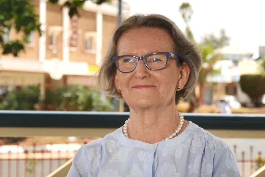 Paroo Shire Mayor Suzette Beresford in focus, with Cunnamulla main street behind her