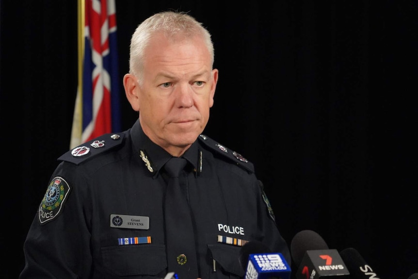 A man with grey hair in a police uniform.