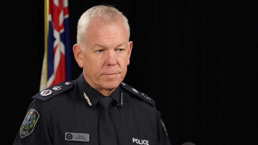 A man with grey hair in a police uniform.