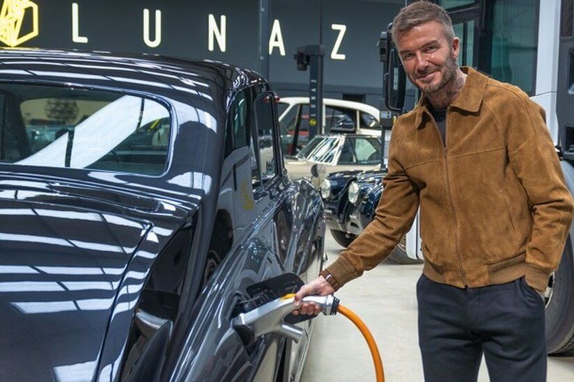David Beckham recharging a classic car EV